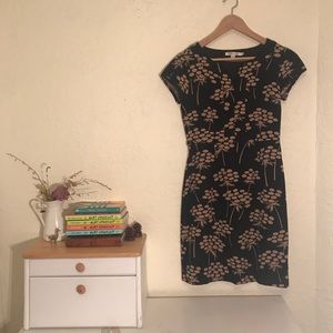 Short sleeve black dress with palm trees.